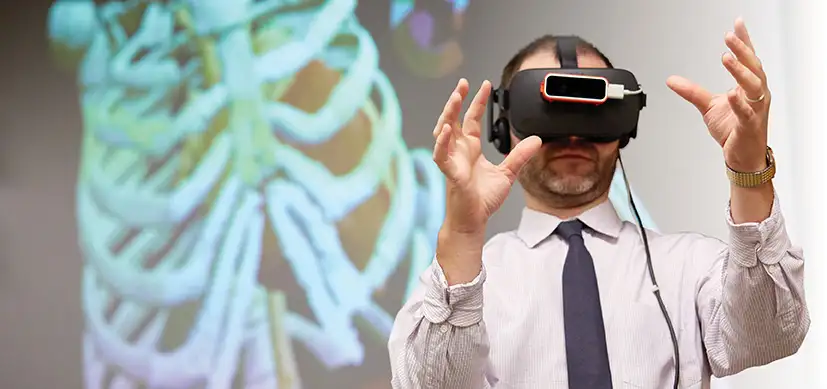 Photo of Ryan Moore, MD using virtual reality technology