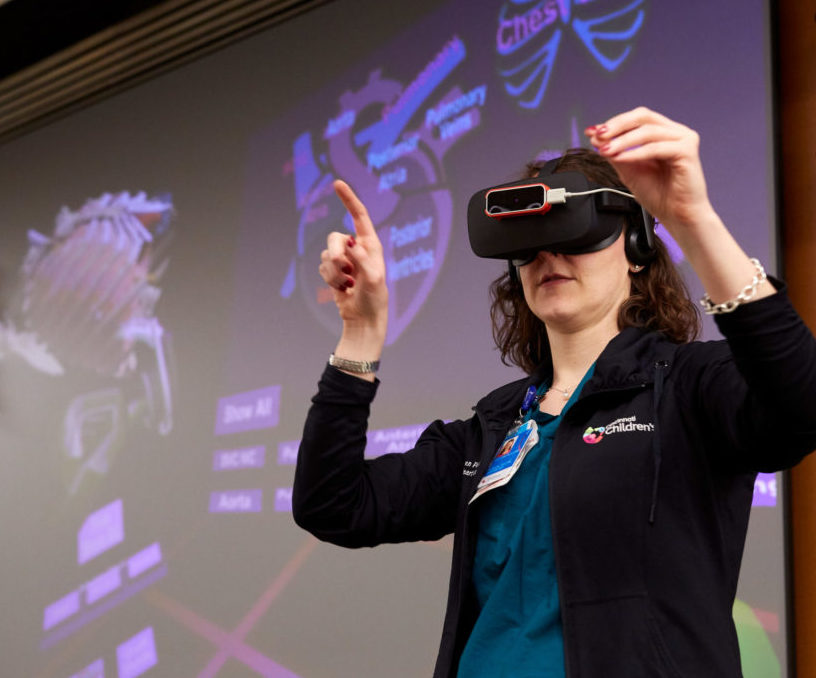 Photo of a woman using virtual reality technology