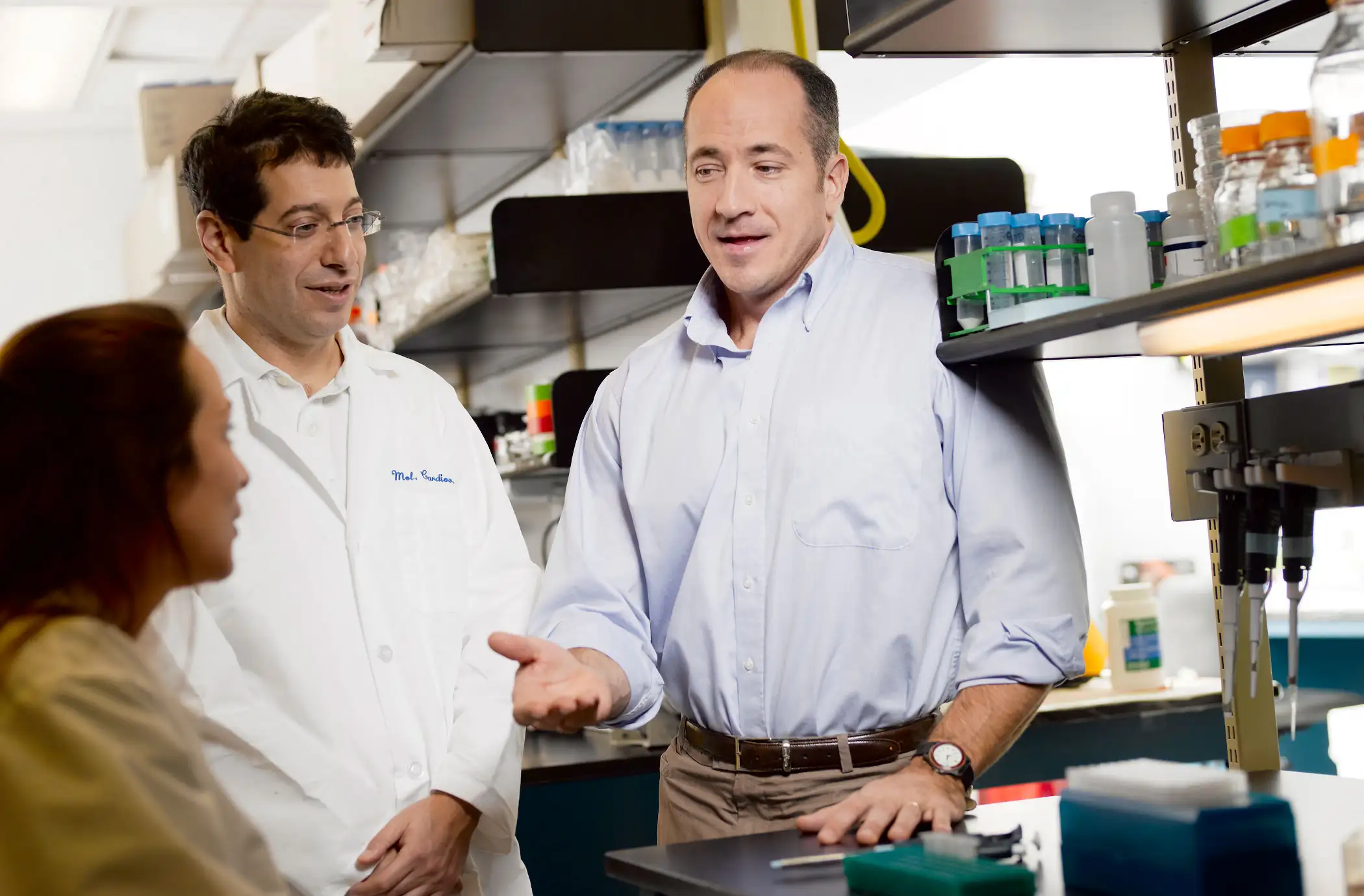 Photo of physicians talking in a laboratory
