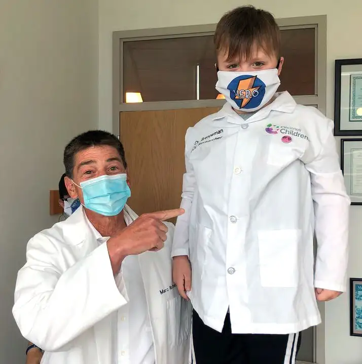Rothenberg posing with one of his patients