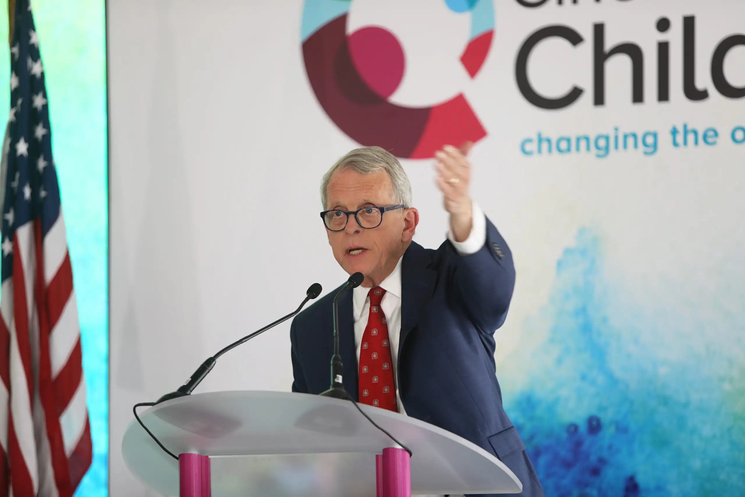 Ohio Gov. Mike DeWine speaking at a podium