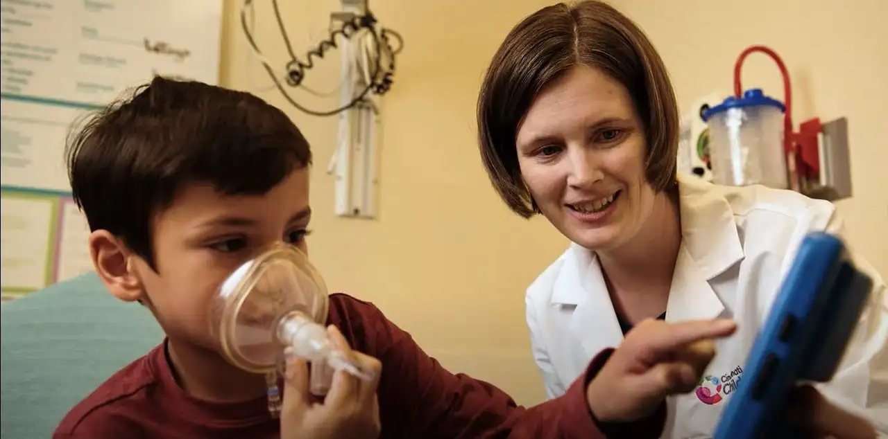 Abby Hess and a patient using her anesthesia app invention