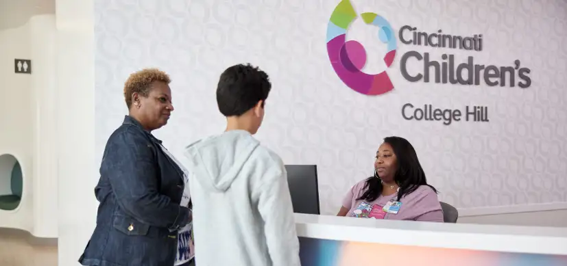 photo of an adult and adolescent entering the Cincinnati Children's College Hill facility