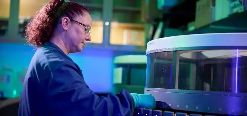 Photo of Betsy DiPasquale working in the Integrated Pathology Research Facility Laboratory