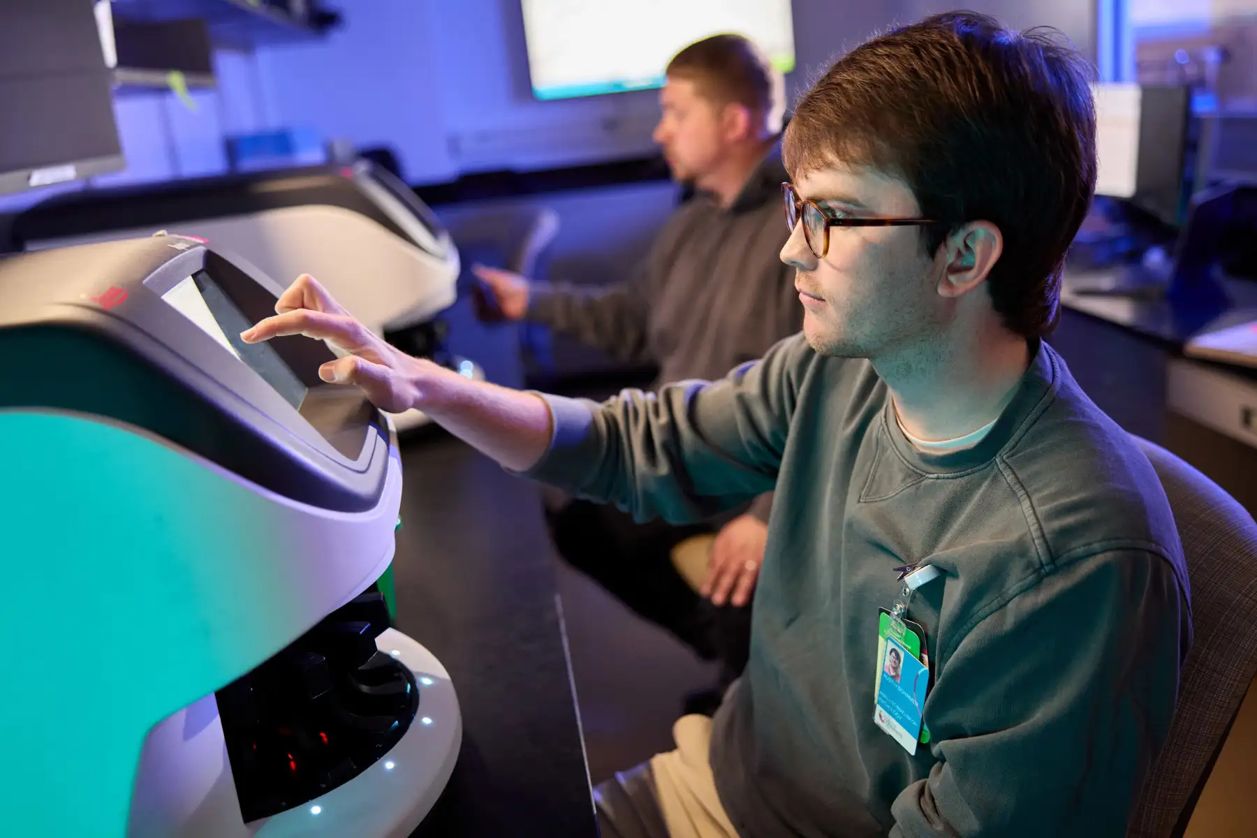 Photo of Austin Schirmer and David Partack working in the Cincinnati Children's Integrated Pathology Research Facility