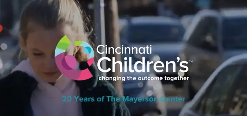 Logo for the Mayerson Center at Cincinnati Children's appears over a video image of a teen girl walking