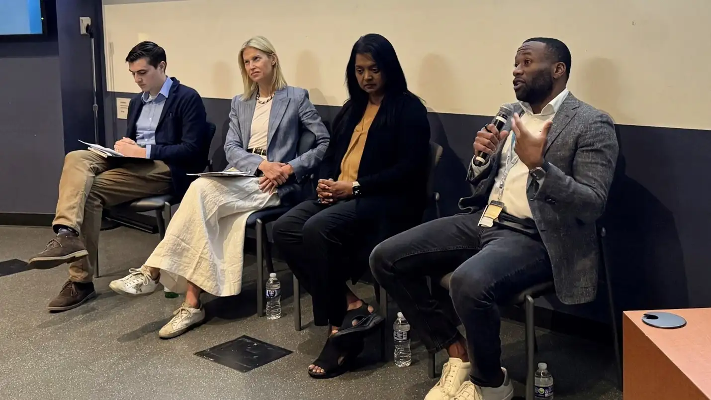 Panelists sit together on the stage sharing insights on commercializing innovations.