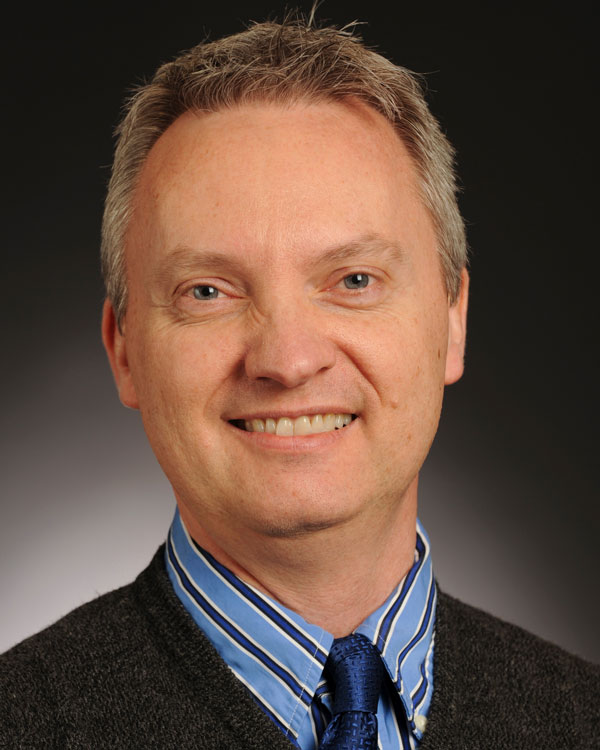 Headshot photo of the late Michael Henrickson