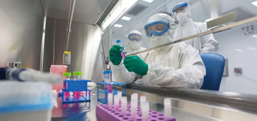 Scientist conducts research in lab.